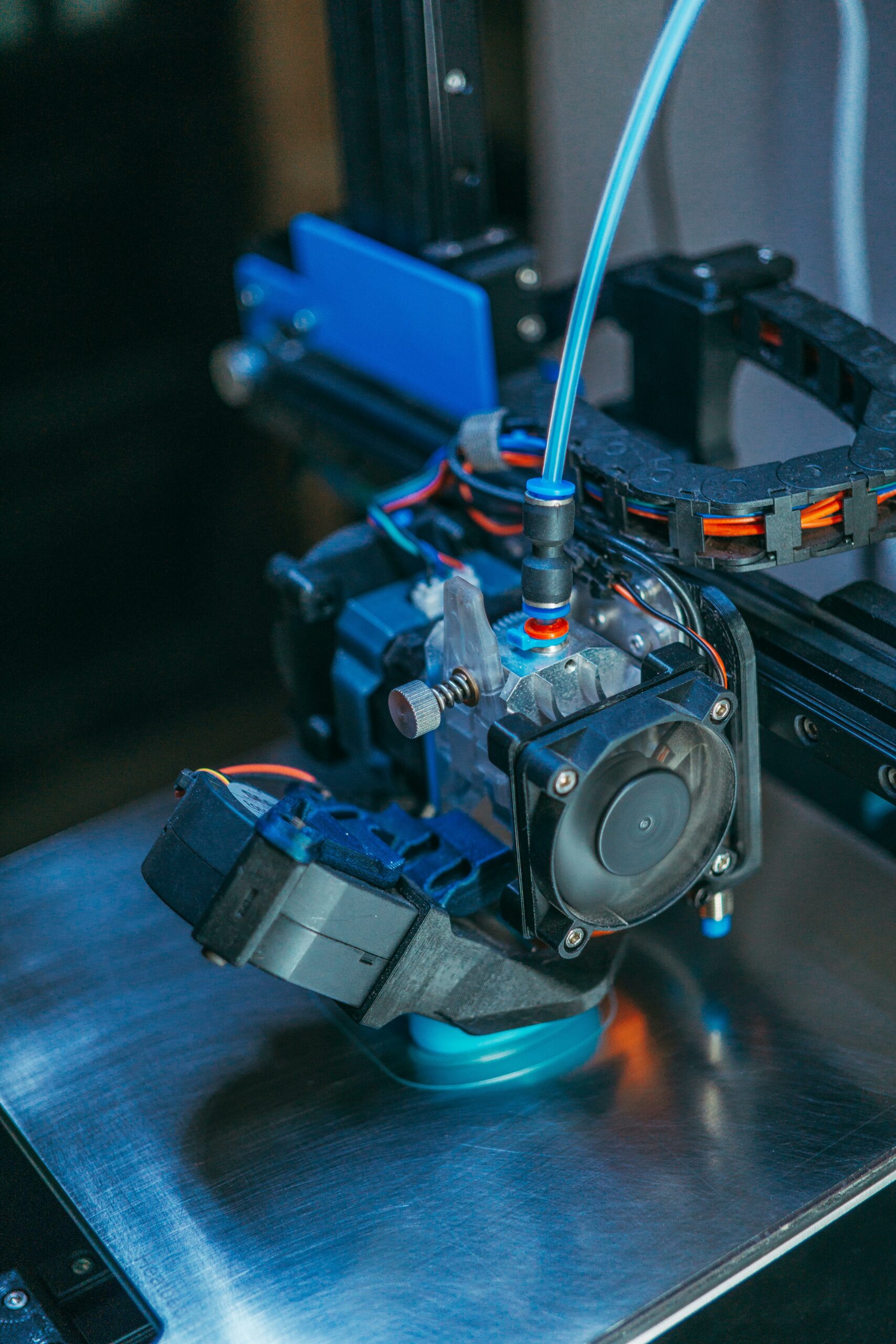 Close-up of 3D printing technology in a manufacturing workshop, representing Industry 4.0 digital transformation